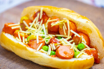 The most traditional Brazilian hot dog, prepared with sausages cut into slices, straw potatoes,...