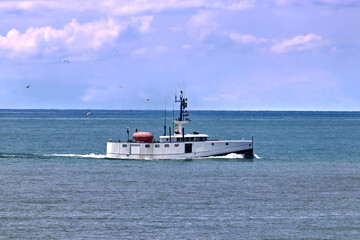 Large fishing vessel in the lake during mid-day - scenes from Bayfield, Huron County, ON, Canada