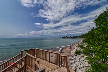 Beautiful cloudscape over Lake Huron, boardwalk and beach - scenes from Bayfield, Huron County, ON, Canada