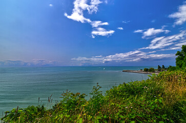 Picture perfect day with small boats, clouds and blue sky over teal waters - scenes from Bayfield, Huron County, ON, Canada