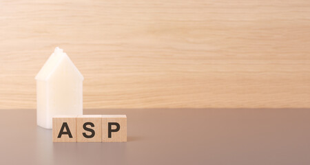 cubes form the word ASP on a light background there is a row of cubes and a toy house in the...