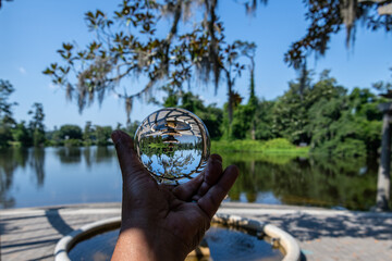 Reflection of fountain at Gazebo by water at Arlie Gardens, Wilmington, NC