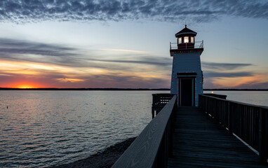 Fototapeta na wymiar Lighthouse Landing Lighthouse at sunset on the boardwalk in Grand Rivers, KY