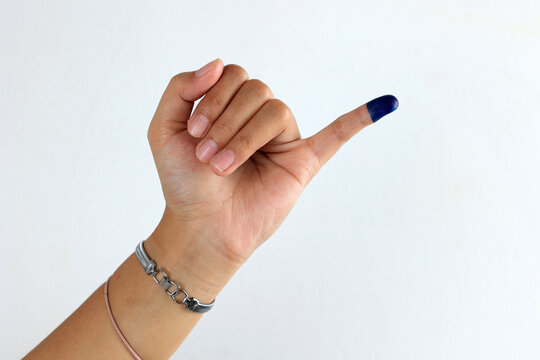 Female Showed hand with Ink for Indonesian ELection or Pemilu Presiden
