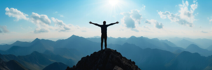 Panorama of young successful man hiker silhouette open arms on mountain peak - obrazy, fototapety, plakaty