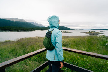 Fototapeta na wymiar tourist in Bahia Lapataia amidst mountains at Tierra del Fuego