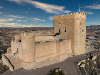 Aerial view of Jumilla medieval castle in Murcia Spain, on a hilltop, imposing irregular shape keep...