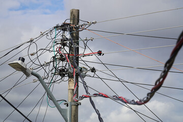 Tangle of cables on electricity pylons. Cable clutter on an street power pole in Manaus, where...