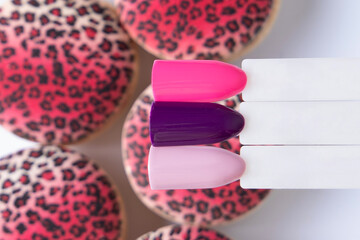 
Romantic color palettes of nail gel polish for manicure and pedicure nails, macaroons background