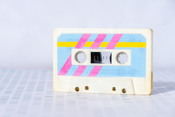 Music cassette with colorful retro labels.