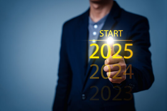 Happy new year 2025 hand touch on a virtual screen 2025. New Goals, Plans, and numbers for Next Year. Businessman touching future growth year 2024 to 2025. Planning, opportunity, business strategy