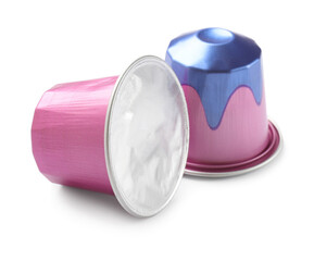 Two plastic coffee capsules isolated on white