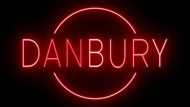 Flickering red retro style neon sign glowing against a black background for DANBURY
