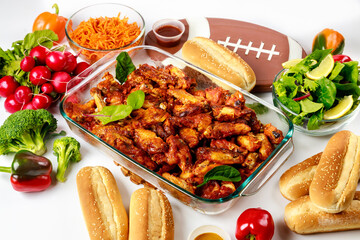 Wings come with a dip sauce and salad for football game party.