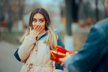 Surprised Girl Feeling Embarrassed for Not Buy a Present. Forgetful girlfriend feeling shy and puzzled forgetting the anniversary
