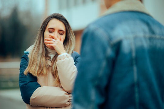 Sad Woman Fighting with her Husband Outdoors in the Park. Woman suffering after a break-up quarrel with her boyfriend
