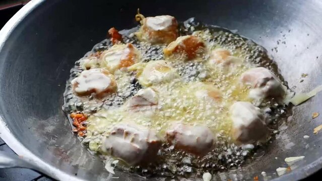 The process of frying tofu containing bean sprouts or commonly called gehu. The Tofu is soaked in cooking oil until cooked until the texture becomes crispy and the color changes to yellowish.