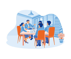 A male leader who works and communicates while sitting in the office with his colleagues. Discuss work. A team of people is sitting at desks with laptop. flat vector modern illustration
