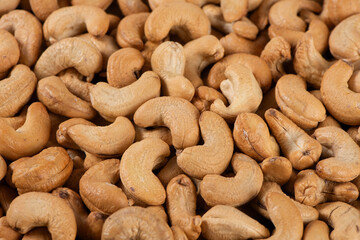 roasted salted cashew nuts texture background.