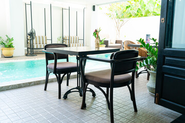 table and chair around swimming pool