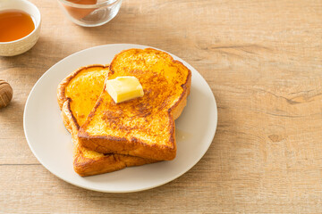 Fototapeta na wymiar French toasted with butter and honey