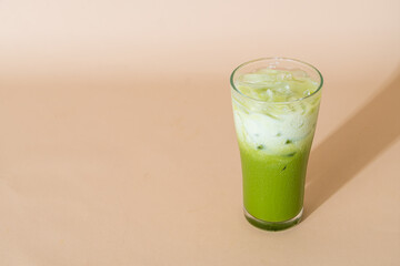 iced matcha green tea latte in glass