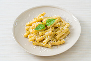 pesto rigatoni pasta with parmesan cheese
