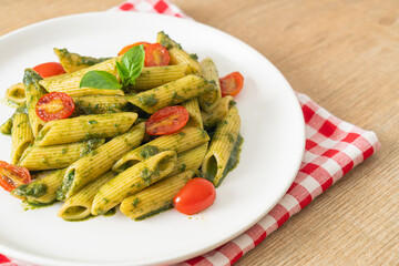 penne pasta with pesto sauce and tomatoes