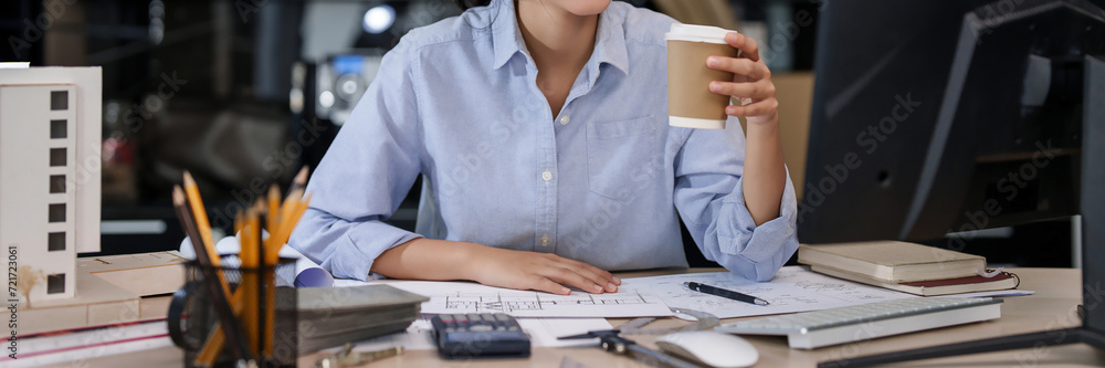 Poster asian architect engineer women drinking hot coffee and checking information about architecture plan 