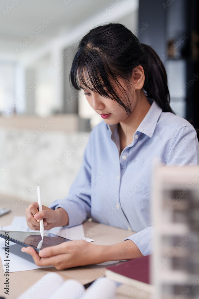 Poster asian architect engineer women using digital tablet to working and drawing architecture plan while c