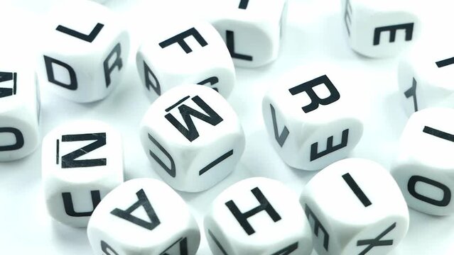 Multicolored alphablocks with english letters slow movement on a white background.