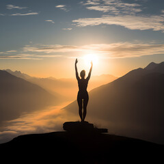 Silhouette of a person practicing yoga on a mountain top