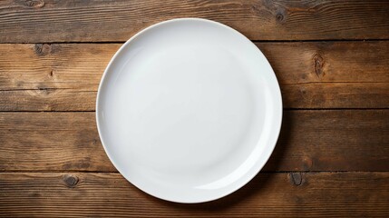 A white ceramic plate on a backdrop of a wooden table setting, mock up, mockup, room for text, copy space