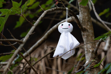 Rainy doll or Japanese teru teru bozu hang on a brach of the tree for lucky good weather and sunny...
