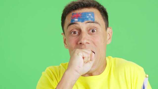 Very nervous man supporting australian team during a difficult match.