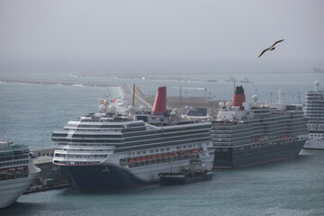 Line up of cruiseships cruise ship liners in port of Barcelona, Spain aerial view from gondola...