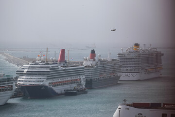 Line up of cruiseships cruise ship liners in port of Barcelona, Spain aerial view from gondola above harbor