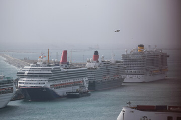 Line up of cruiseships cruise ship liners in port of Barcelona, Spain aerial view from gondola...