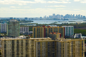 View from above of luxurious highrise hotels and condos on Atlantic ocean shore in Sunny Isles Beach city. American tourism infrastructure in southern Florida