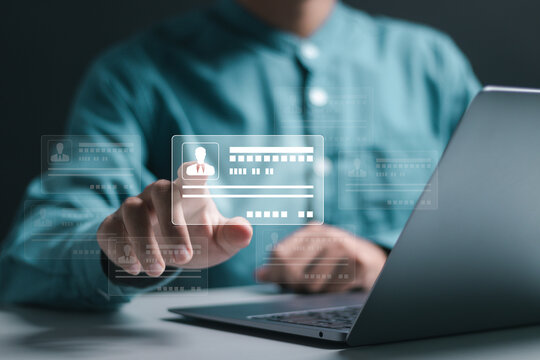 Digital identification or digital ID concept. Businessman use laptop and hand touch virtual screen of digital identification card to accessing databases by digital identity for cyber security.