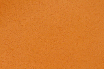abstract textured orange colored paper background