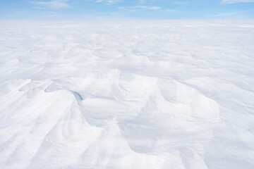 Empty fell landscape on a cold winter day with beautiful texture on the snow