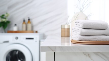 A clean and bright laundry room featuring a modern washing machine, folded towels, and bathroom accessories on a marble countertop.