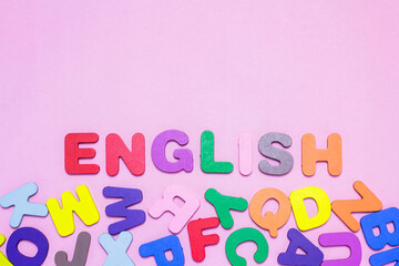 English letters scattered on a black background Ideas for developing grammatical thinking English learning concept