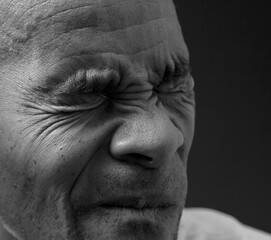 deafness suffering from hearing loss on grey black background with people stock image stock photo	