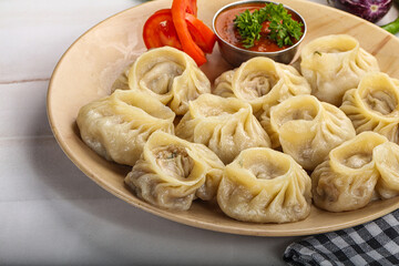 Steamed Nepali dumpling Momo with sauce
