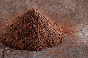 Cocoa powder and on a wooden table