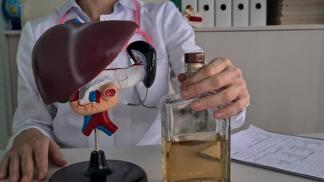 Alcoholic liver damage and liver cirrhosis concept with liver and alcohol. Cirrhosis by alcoholism hepatitis B or C or non-alcoholic fatty liver disease