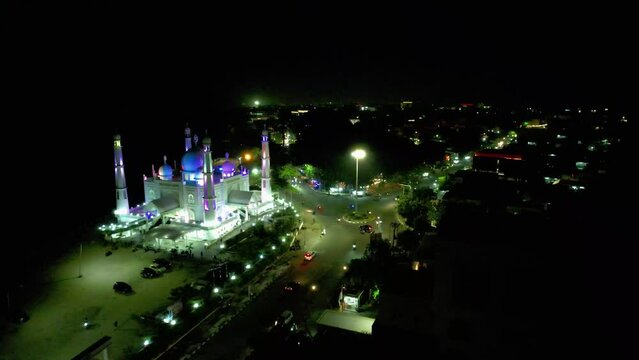 Aerial view at night of the Al-Hakim Mosque near the coast of Padang City, West Sumatra.
