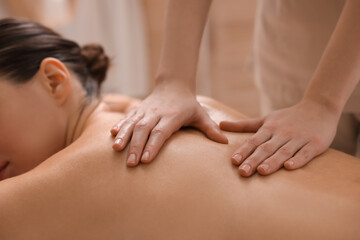 Fototapeta na wymiar Woman receiving back massage in spa salon, closeup